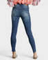 Blue jeans worn by a person on a white background