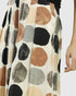 Long skirt with a pattern of large, multicolored circles on a plain background