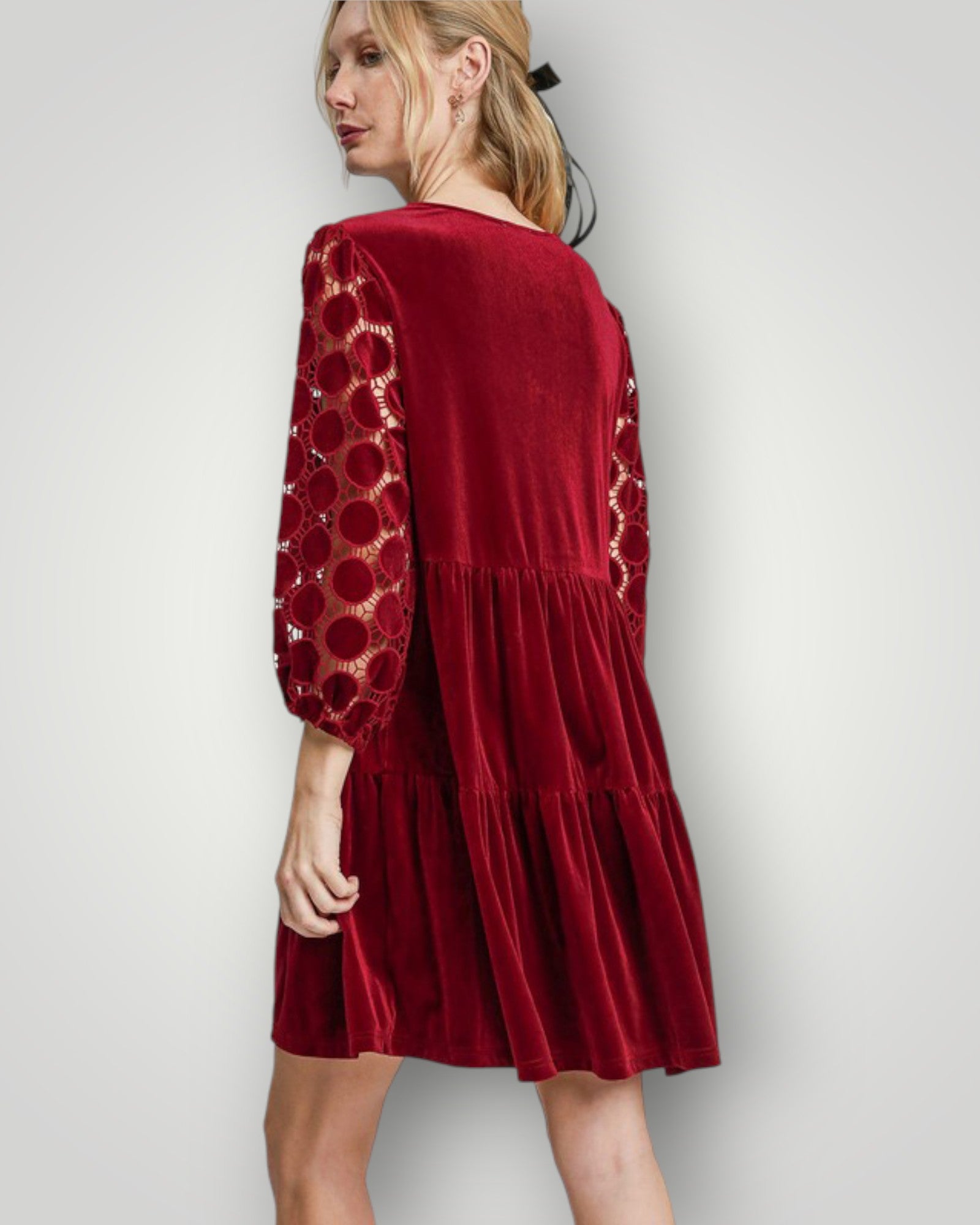 Red dress with lace sleeves on a white background