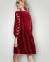 Red dress with lace sleeves on a white background