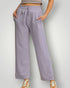Person wearing lavender sweatpants on a plain background