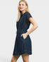 Woman wearing a denim dress on a white background