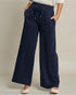 Navy wide-leg pants worn by a person on a neutral background