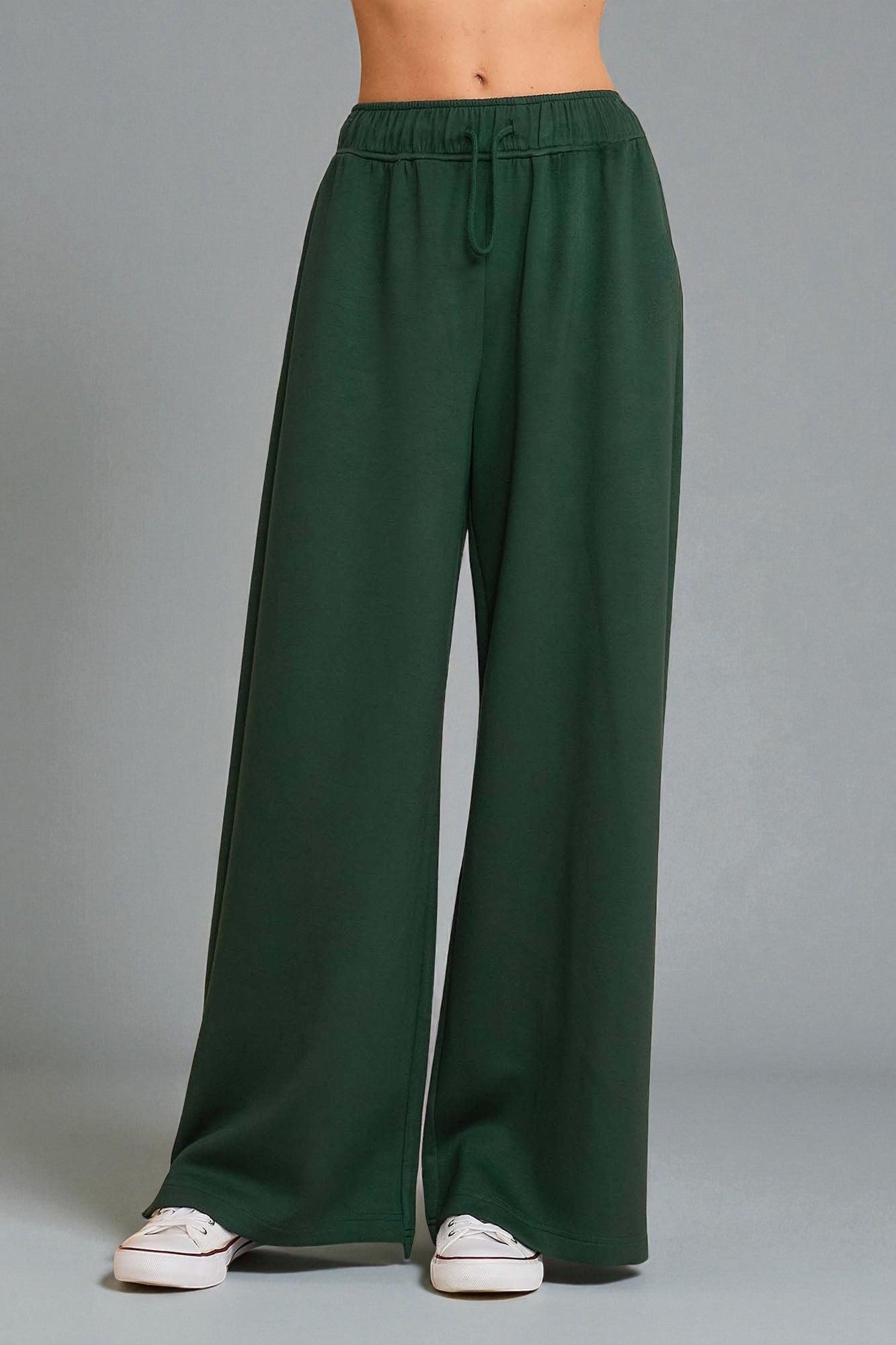 Green wide-leg pants on a gray background