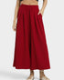 Red wide-leg pants worn by a person on a white background