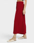 Red skirt worn by a person on a white background