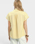 Woman wearing a yellow striped shirt on a white background