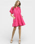 Woman wearing a pink dress on a white background