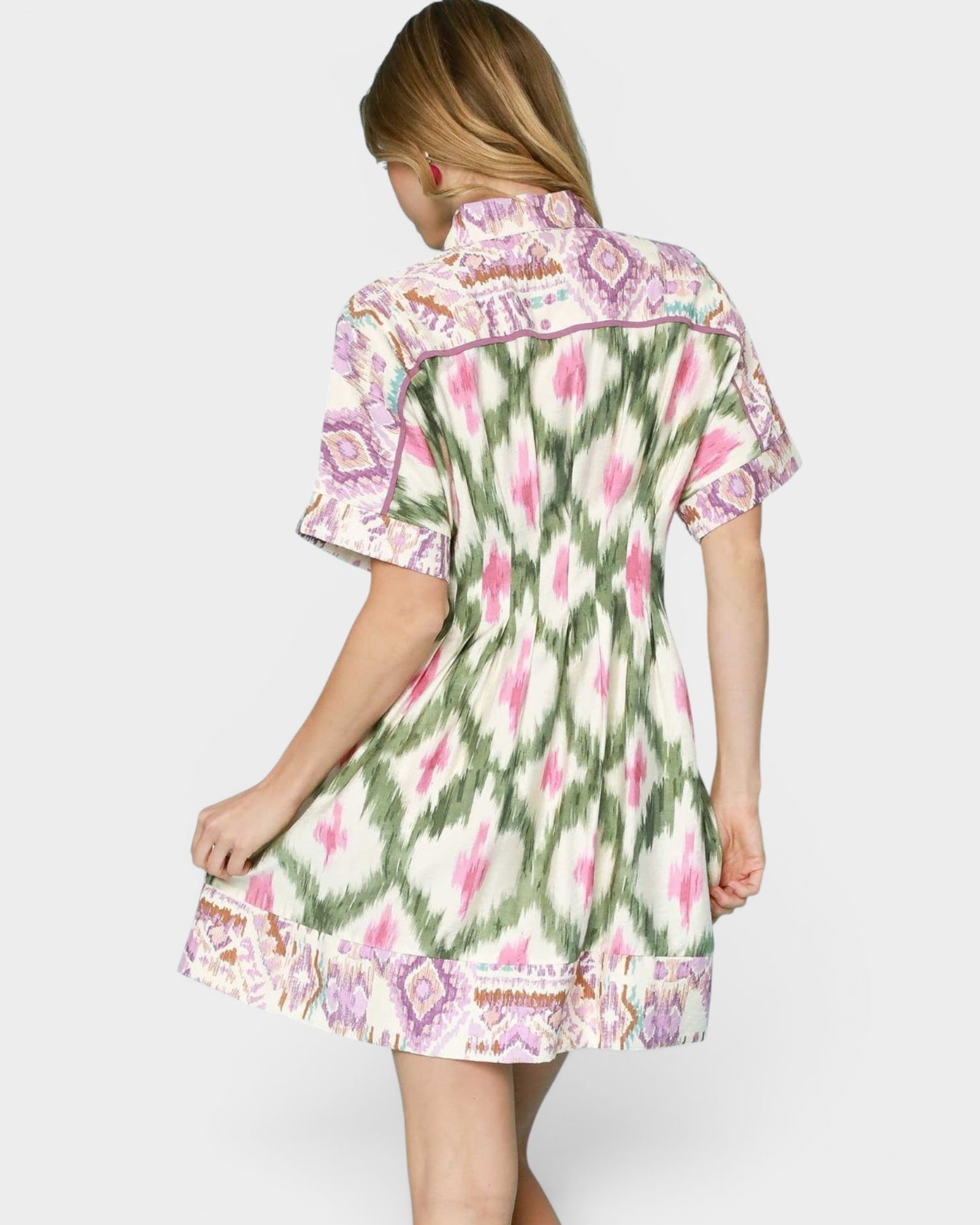 Woman wearing a floral dress on a white background