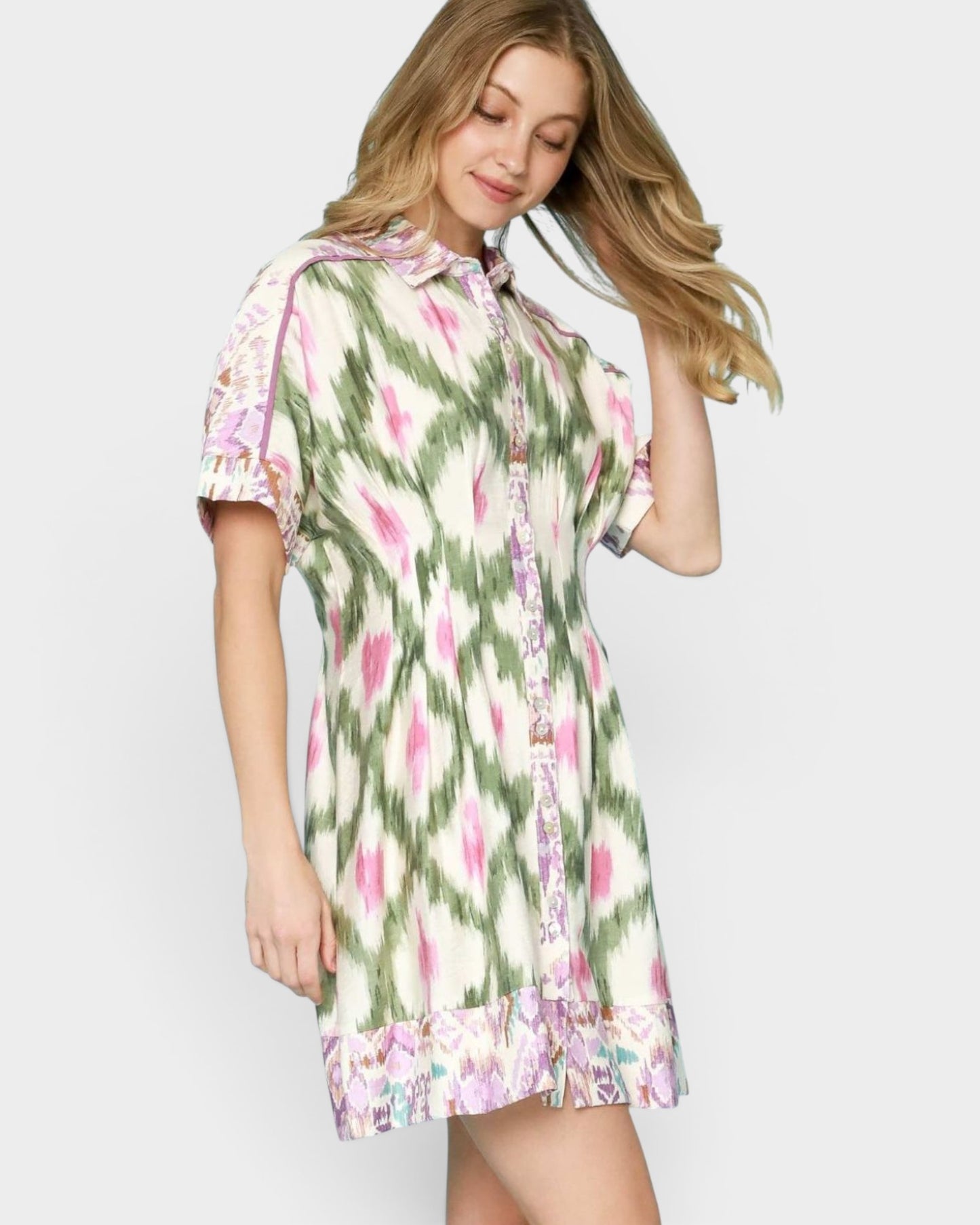 Woman wearing a floral dress on a white background