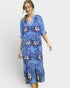 Woman wearing a blue floral dress on a white background