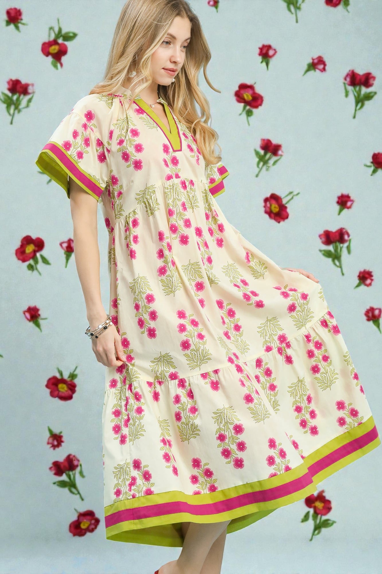 Woman wearing a floral dress with a light blue background and flower patterns