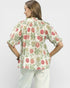Woman wearing a floral blouse with a white background