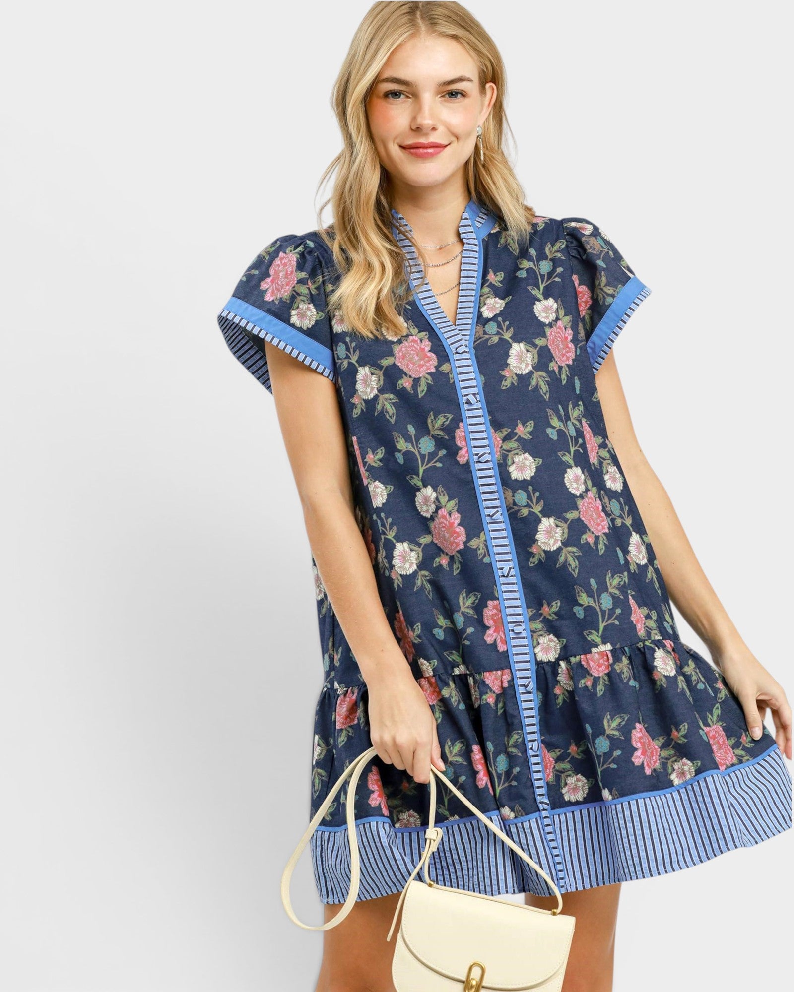Woman wearing a floral dress with a white background