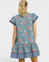 Woman wearing a blue floral dress on a white background