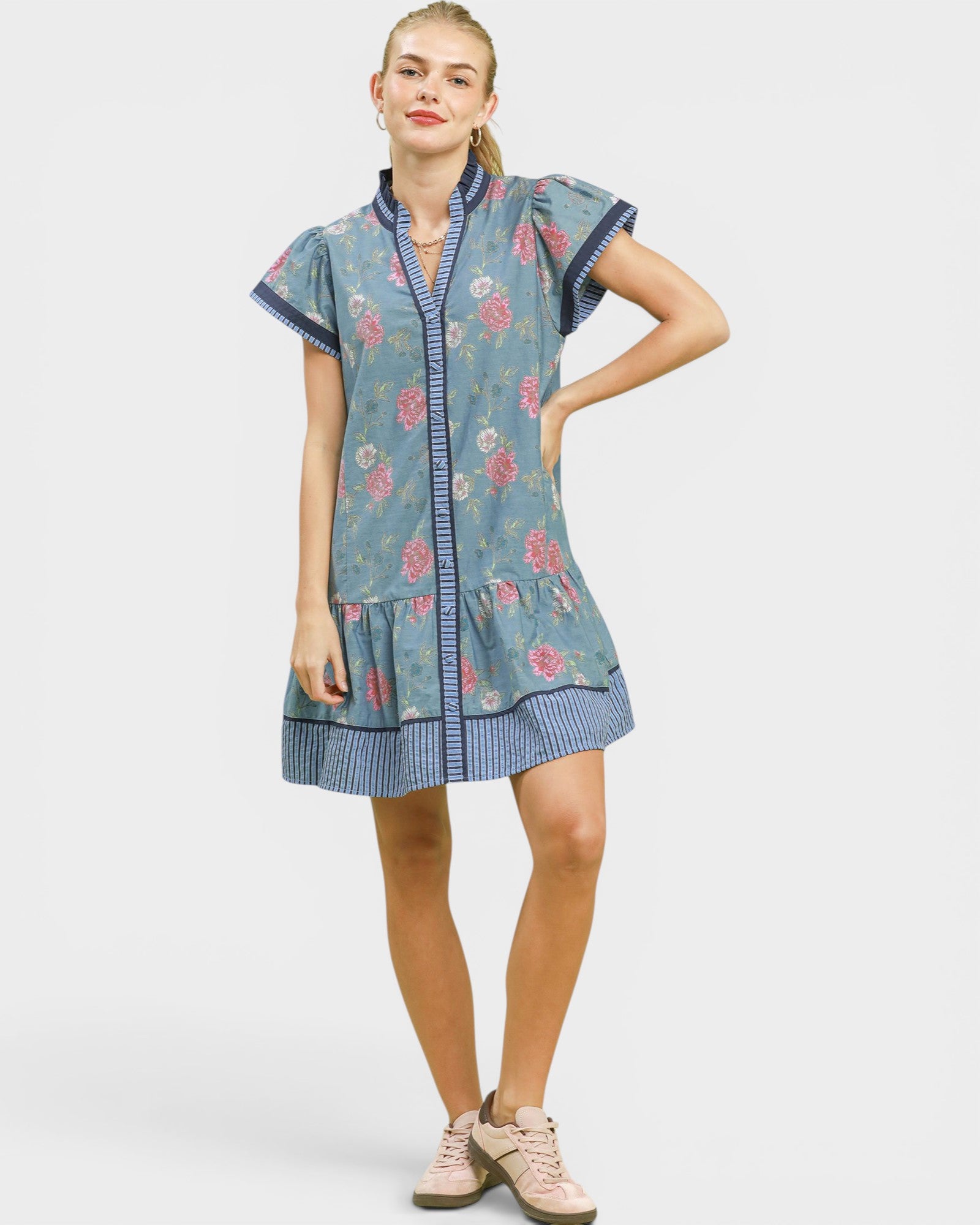Woman wearing a floral dress with a white background