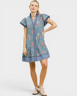 Woman wearing a floral dress with a white background