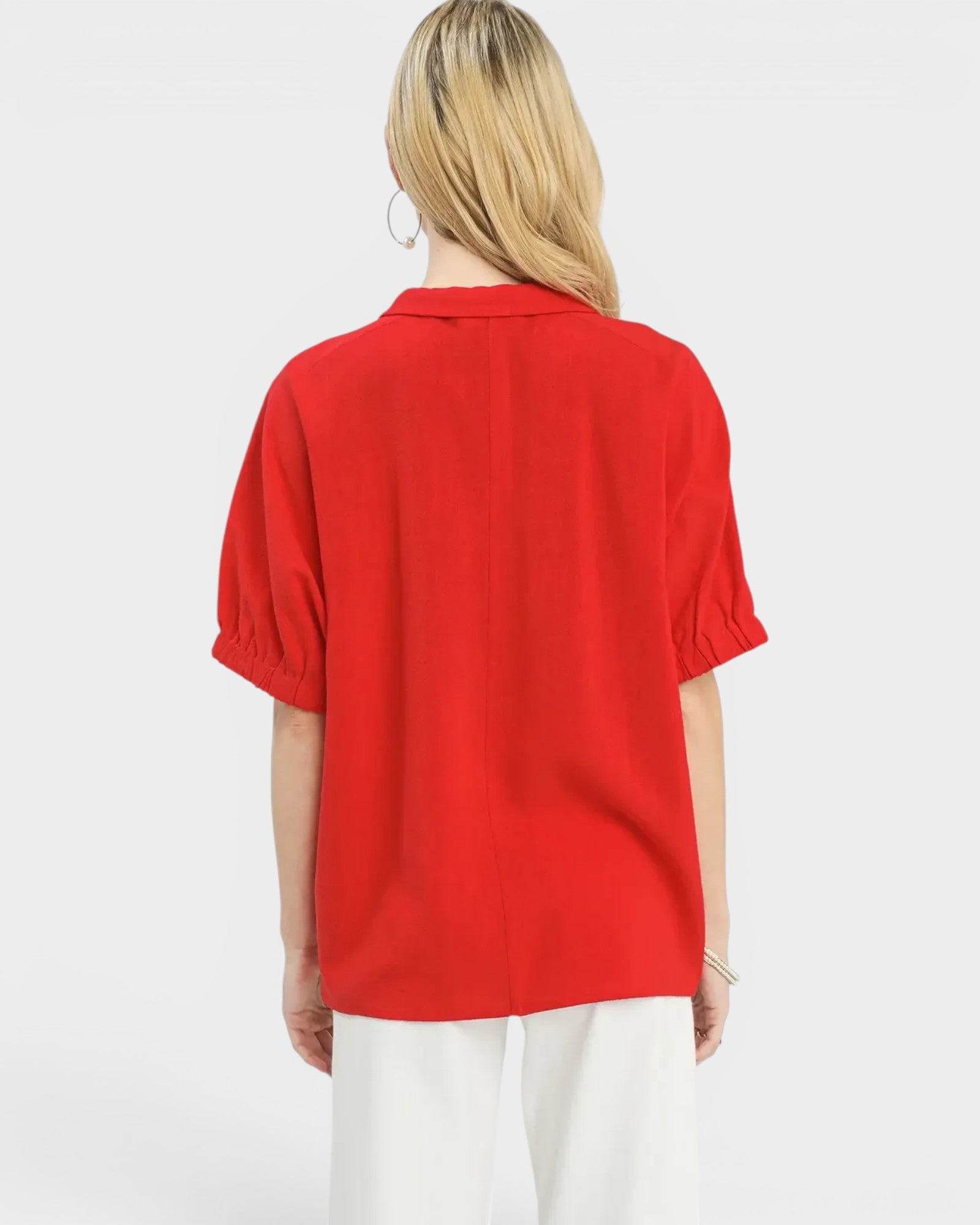 Person wearing a red shirt on a white background