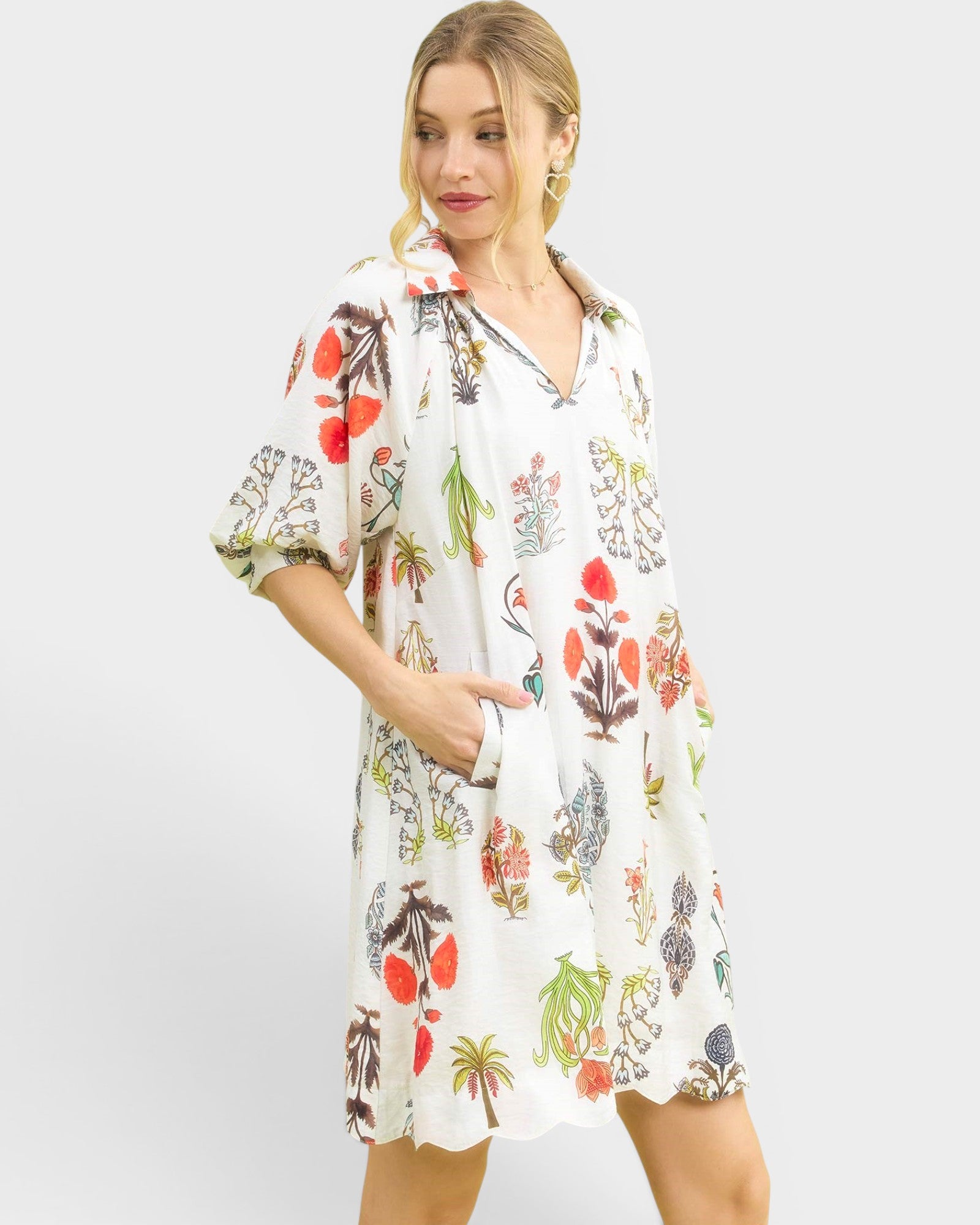 Woman wearing a floral dress on a white background
