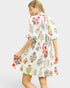 Woman wearing a floral dress on a white background