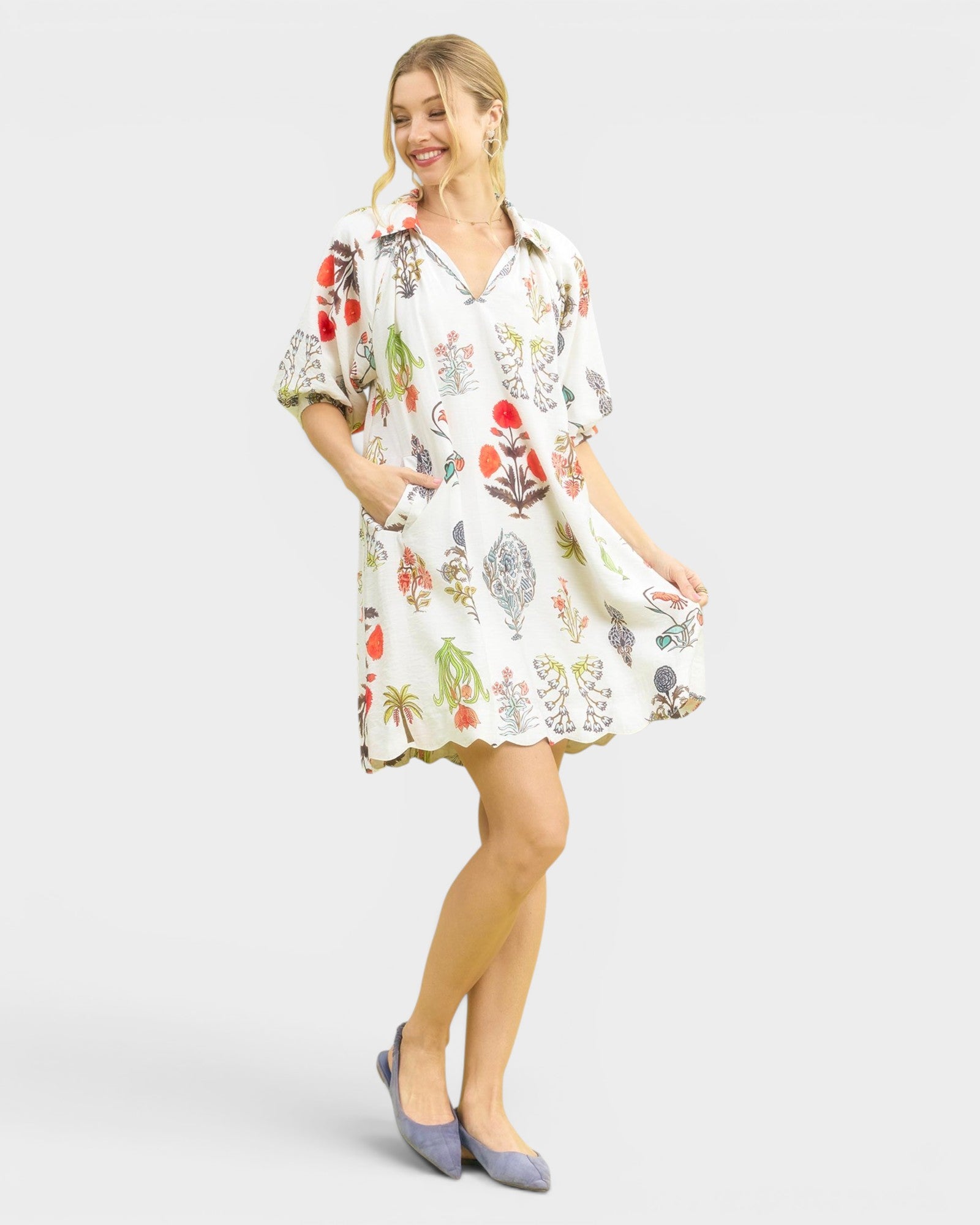 Woman wearing a floral dress on a white background