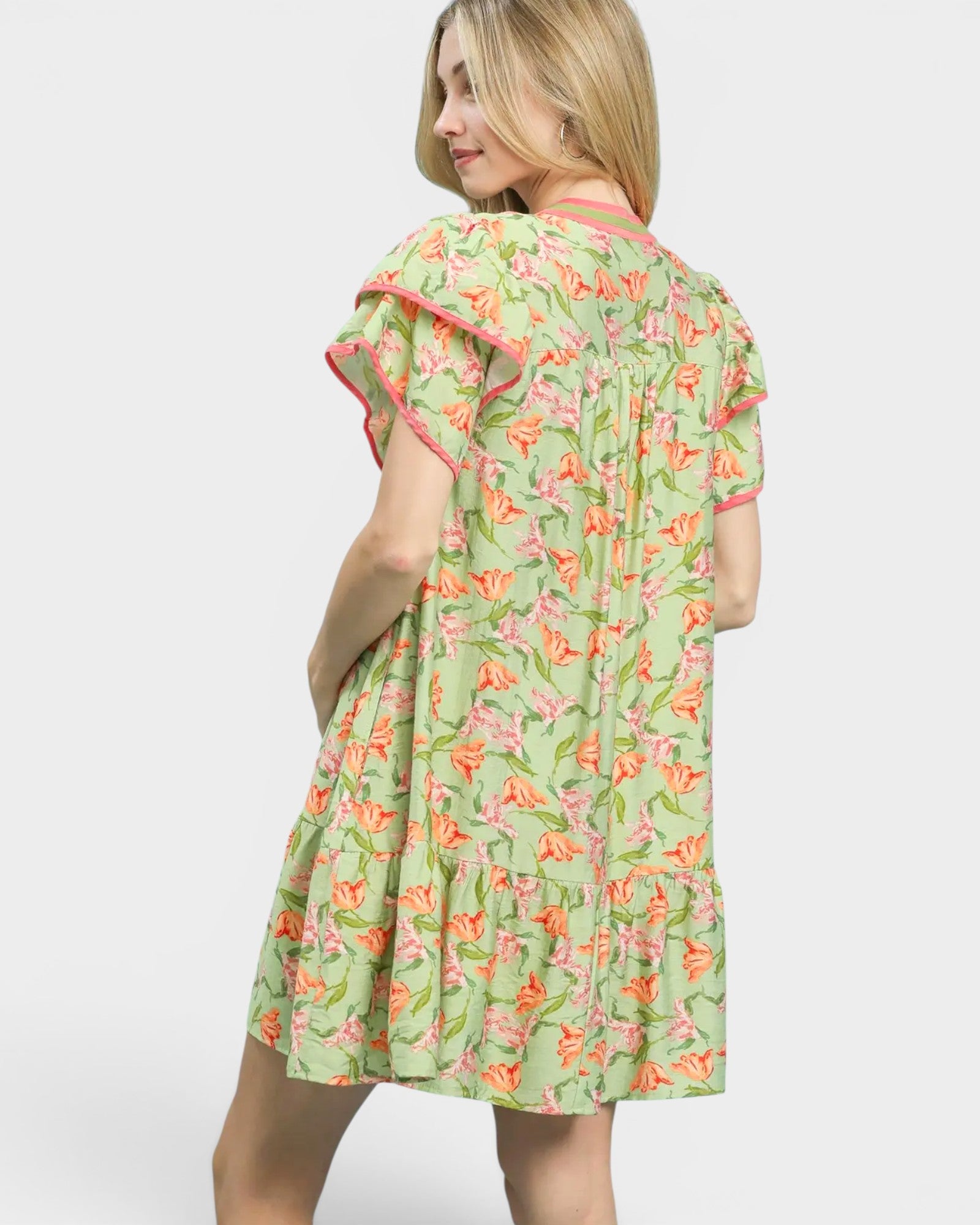 Woman wearing a floral dress on a white background