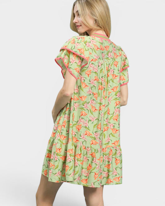 Woman wearing a floral dress on a white background