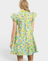 Woman wearing a colorful floral dress on a white background