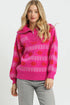Woman wearing a pink patterned sweater against a white background