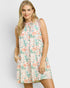 Woman wearing a floral dress on a plain background