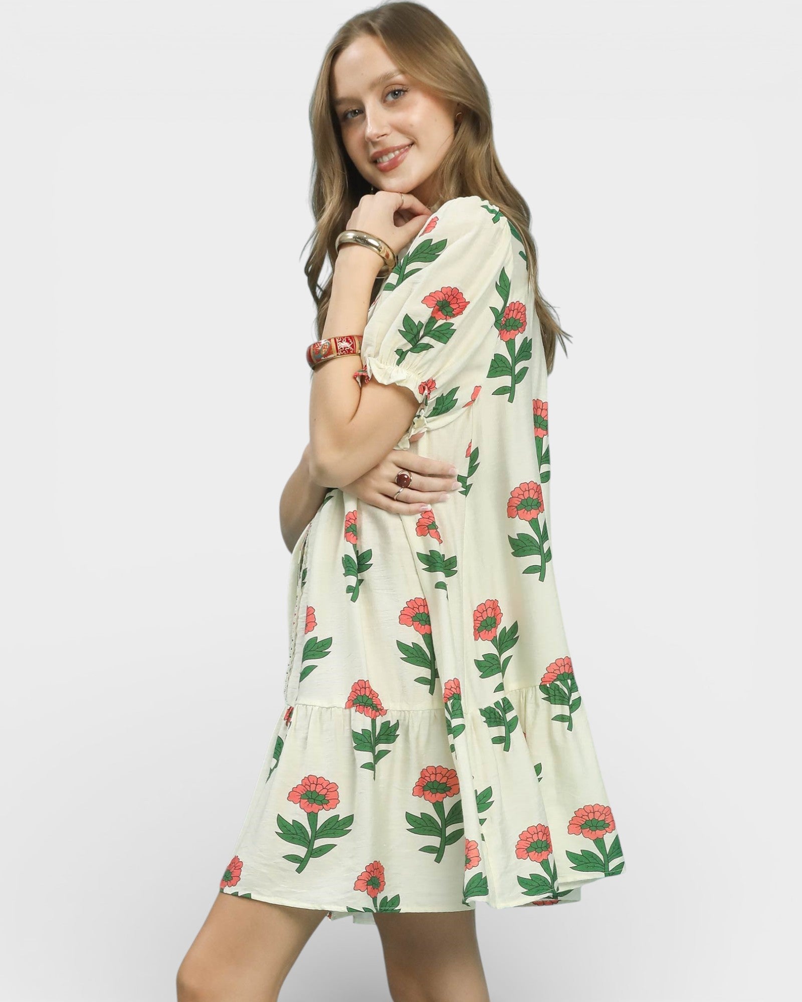 Woman wearing a floral dress on a white background