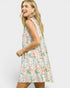Woman wearing a floral dress on a white background