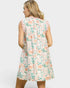 Woman wearing a floral dress on a white background