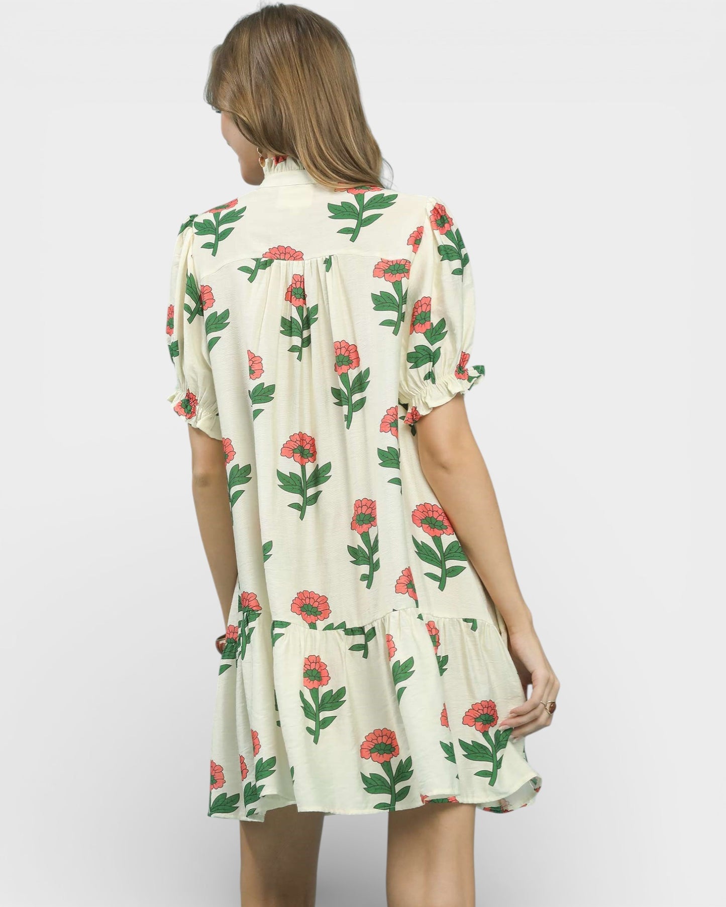 Woman wearing a floral dress on a white background