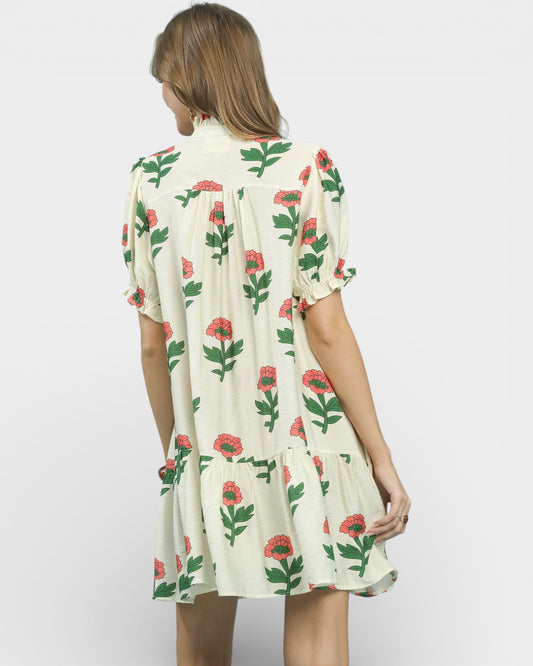 Woman wearing a floral dress on a white background