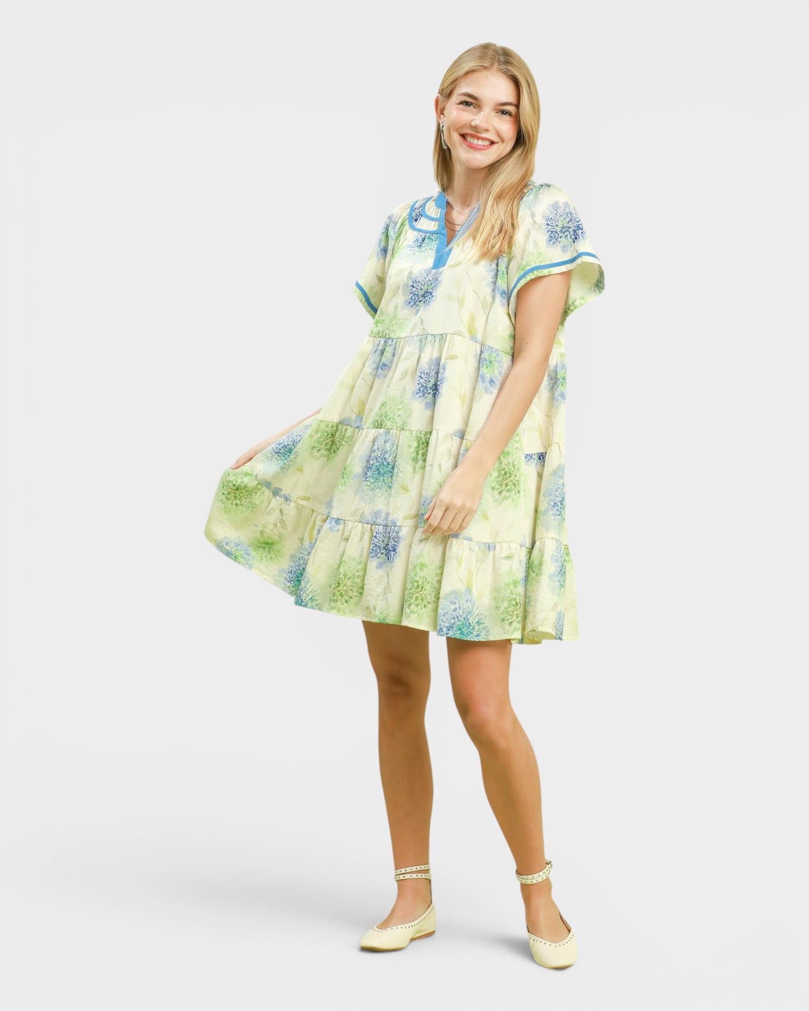 Woman wearing a floral dress on a white background