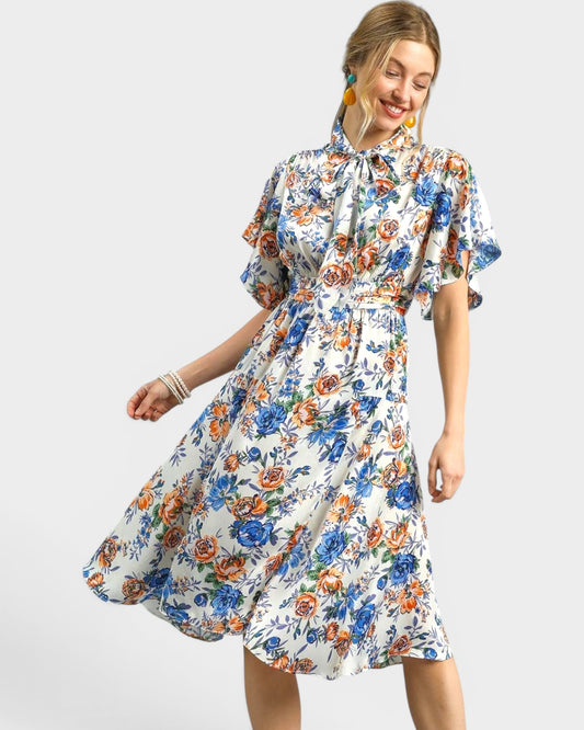 Woman wearing a floral dress on a white background