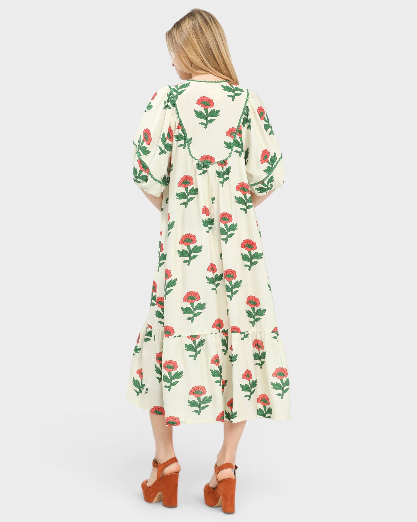 Woman wearing a floral dress on a white background