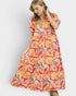 Woman wearing a colorful floral dress on a white background