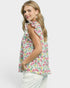 Woman wearing a sleeveless floral top on a white background
