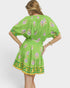 Green dress with floral patterns on a white background