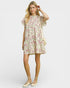 Woman wearing a floral dress on a white background
