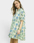 Woman wearing a floral dress on a white background