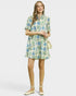 Woman wearing a floral dress on a white background
