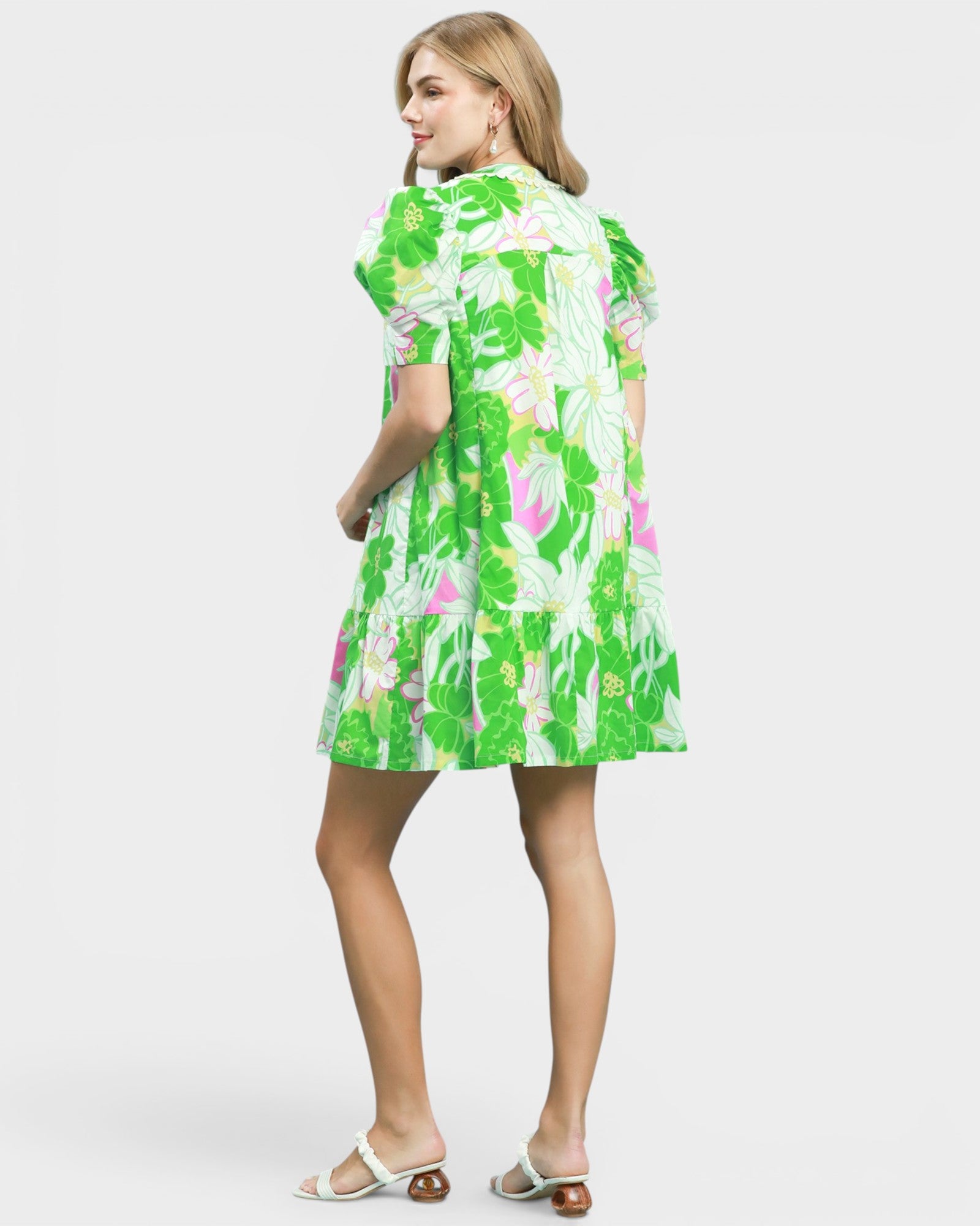 Woman wearing a floral dress on a white background