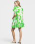 Woman wearing a floral dress on a white background