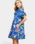 Woman wearing a blue floral dress on a white background