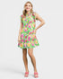 Woman wearing a colorful floral dress on a white background