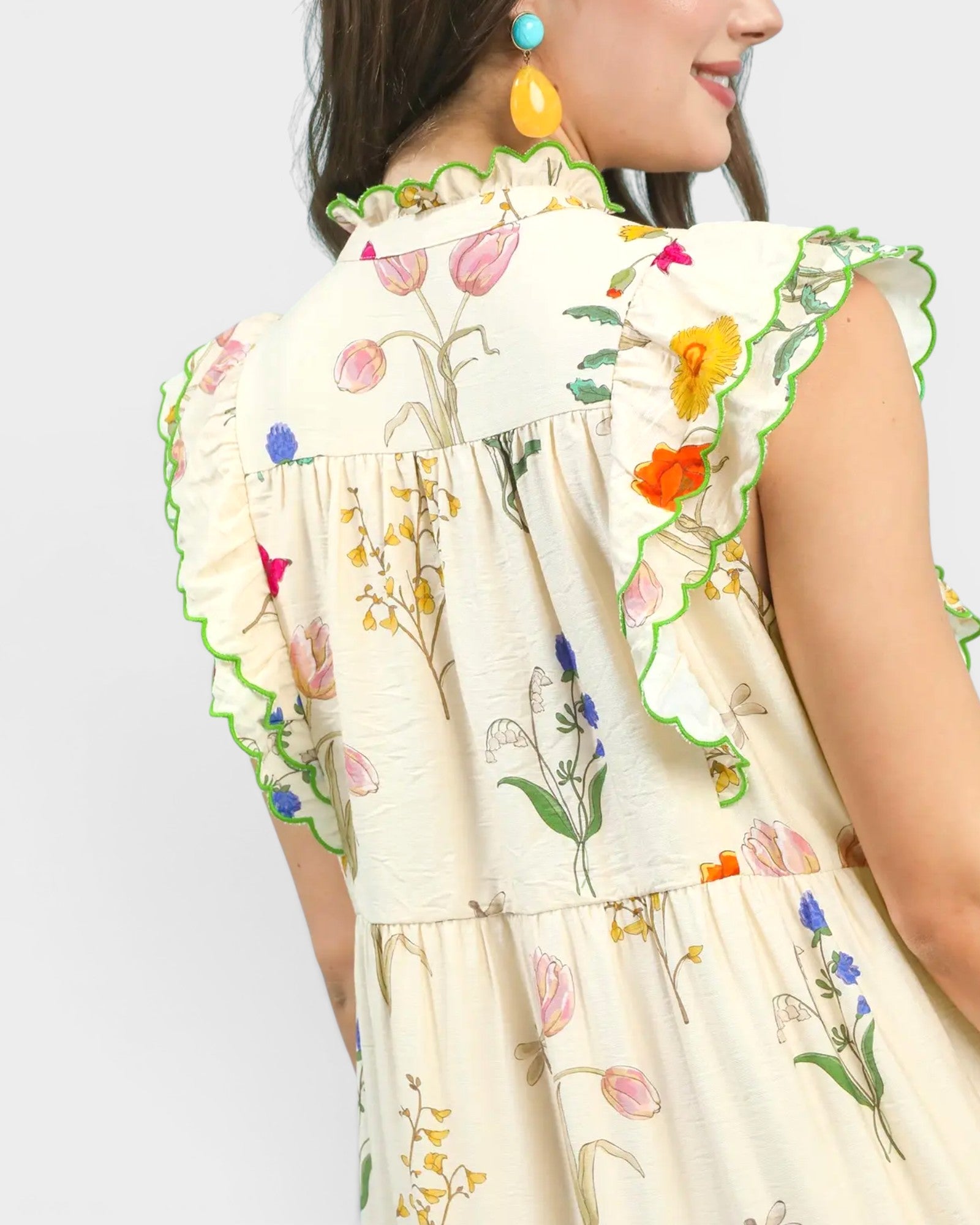 Woman wearing a floral dress with a white background
