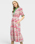 Woman wearing a floral dress with a white background